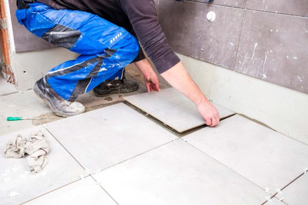 Man Changing Bathroom Floor Tiles